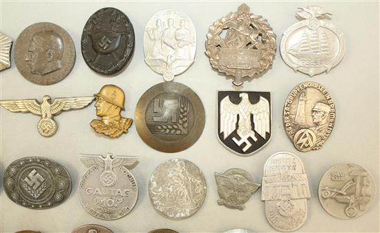 A large collection of various German Third Reich badges,